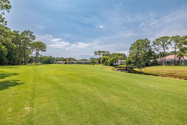 359 Indigo Loop, Miramar Beach, FL 32550 - view of home's community featuring a lawn, golf course view, and a water view