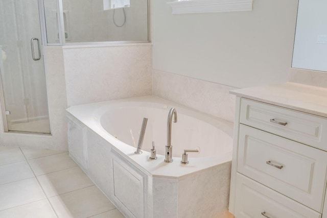 359 Indigo Loop, Miramar Beach, FL 32550 - bathroom featuring a shower stall, a garden tub, vanity, and tile patterned flooring
