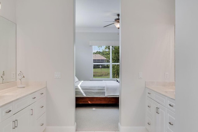 359 Indigo Loop, Miramar Beach, FL 32550 - ensuite bathroom with two vanities, ceiling fan, baseboards, and crown molding