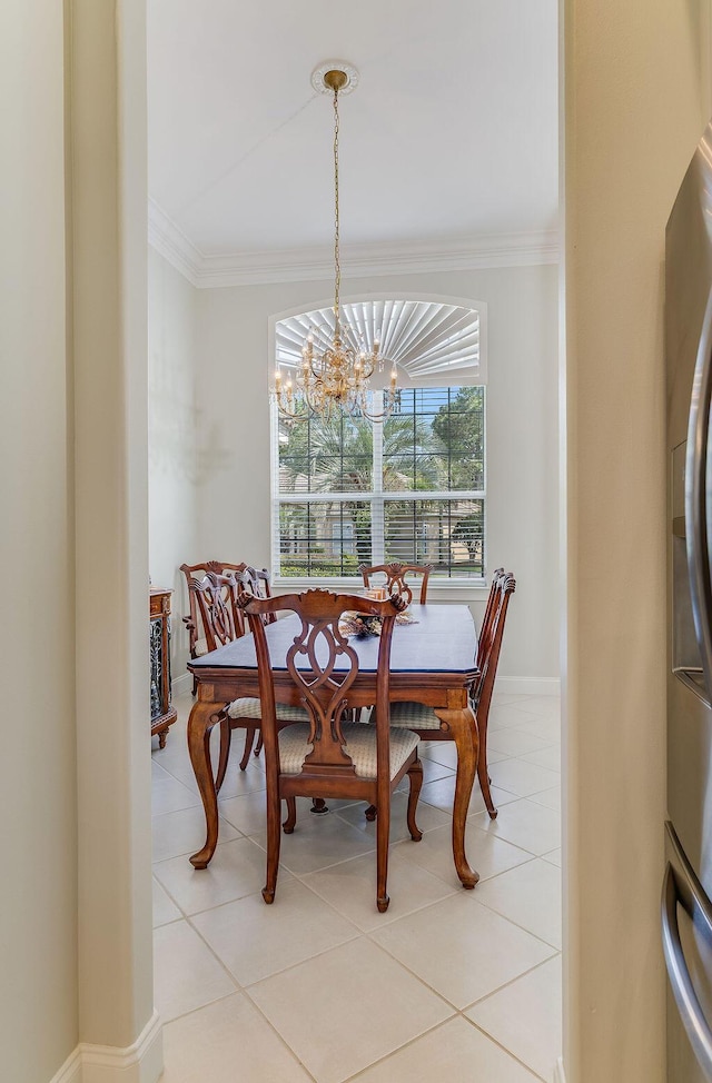 359 Indigo Loop, Miramar Beach, FL 32550 - dining room featuring crown molding, a chandelier, light tile patterned flooring, and baseboards