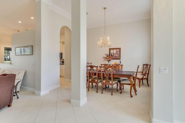 359 Indigo Loop, Miramar Beach, FL 32550 - dining space with crown molding, arched walkways, recessed lighting, a chandelier, and baseboards