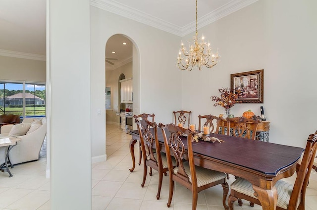 359 Indigo Loop, Miramar Beach, FL 32550 - dining area with arched walkways, ornamental molding, light tile patterned floors, a chandelier, and baseboards