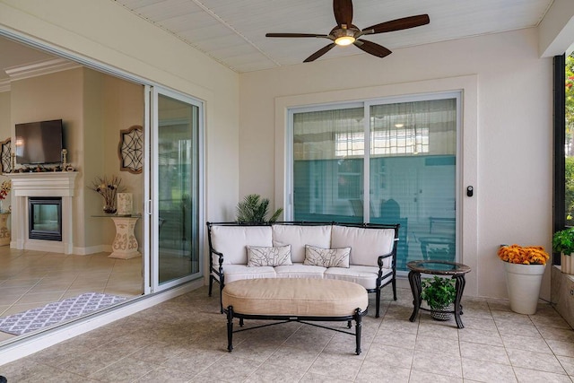 359 Indigo Loop, Miramar Beach, FL 32550 - sunroom / solarium with ceiling fan and an outdoor living space with a fireplace