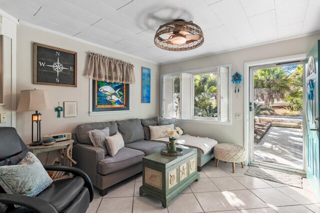 40 Flounder St, Santa Rosa Beach, FL 32459 - living room with light tile patterned flooring and ornamental molding