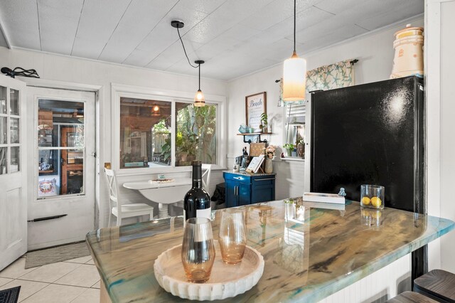 40 Flounder St, Santa Rosa Beach, FL 32459 - dining room with light tile patterned flooring and ornamental molding