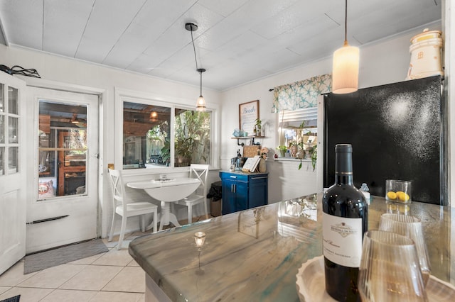 40 Flounder St, Santa Rosa Beach, FL 32459 - dining area with ornamental molding and tile patterned floors