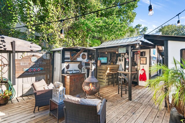 40 Flounder St, Santa Rosa Beach, FL 32459 - wooden terrace with an outdoor fire pit