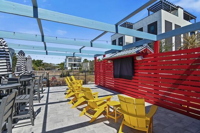 40 Flounder St, Santa Rosa Beach, FL 32459 - view of patio featuring outdoor dining space and an outbuilding
