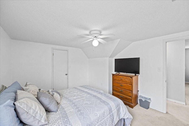 1176 Lost Trl, Fort Walton Beach, FL 32547 - bedroom featuring light carpet, a textured ceiling, ceiling fan, baseboards, and lofted ceiling