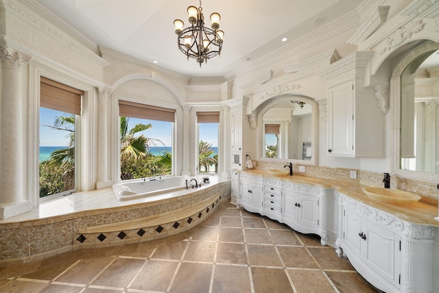 30 Pelican Cir, Inlet Beach, FL 32461 - bathroom featuring double vanity, a bath, a chandelier, a towering ceiling, and recessed lighting