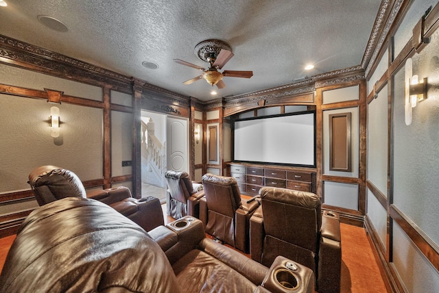 30 Pelican Cir, Inlet Beach, FL 32461 - cinema room featuring baseboards, a textured wall, a textured ceiling, a ceiling fan, and carpet
