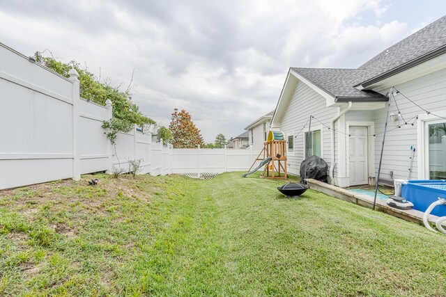 409 Hideaway Ln, Niceville, FL 32578 - fenced backyard featuring a playground