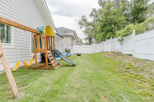 409 Hideaway Ln, Niceville, FL 32578 - fenced backyard with a playground