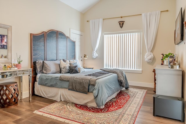 409 Hideaway Ln, Niceville, FL 32578 - bedroom featuring lofted ceiling and light wood-style flooring