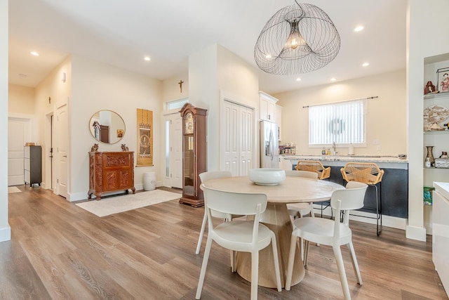 409 Hideaway Ln, Niceville, FL 32578 - dining area with a chandelier, light wood-style floors, and recessed lighting