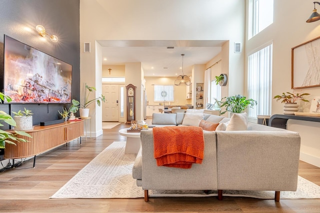 409 Hideaway Ln, Niceville, FL 32578 - living room featuring a towering ceiling and wood finished floors