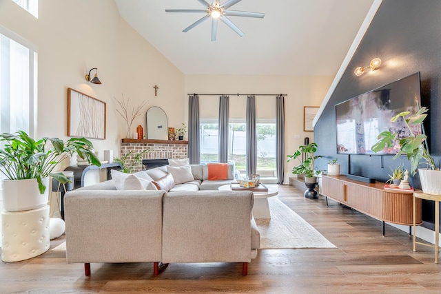 409 Hideaway Ln, Niceville, FL 32578 - living area with ceiling fan, high vaulted ceiling, wood finished floors, and a fireplace