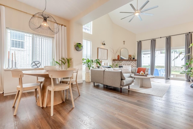 409 Hideaway Ln, Niceville, FL 32578 - dining room with high vaulted ceiling, plenty of natural light, wood finished floors, and a ceiling fan