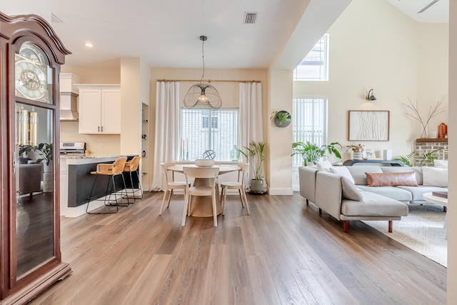 409 Hideaway Ln, Niceville, FL 32578 - living area with light wood-type flooring, recessed lighting, and a towering ceiling