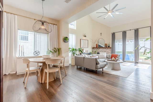 409 Hideaway Ln, Niceville, FL 32578 - dining area with high vaulted ceiling, healthy amount of natural light, ceiling fan, and wood finished floors