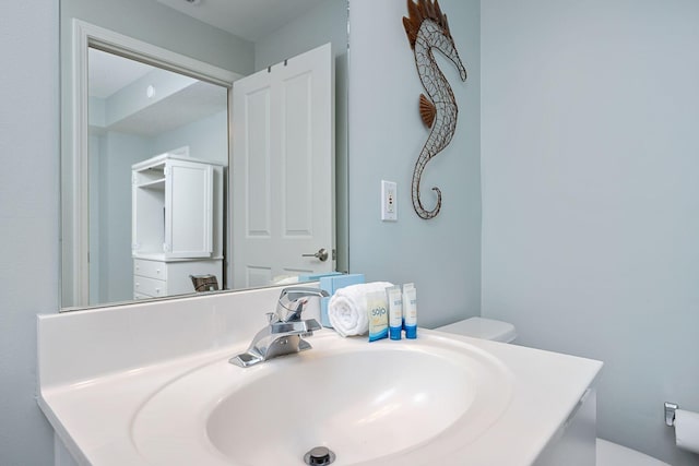 1515 SE Miracle Strip Pkwy Unit 613, Fort Walton Beach, FL 32548 - half bathroom with vanity and toilet