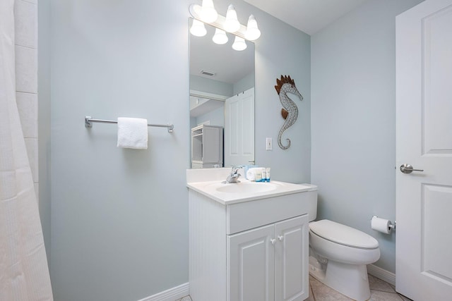 1515 SE Miracle Strip Pkwy Unit 613, Fort Walton Beach, FL 32548 - bathroom with toilet, vanity, baseboards, and tile patterned floors