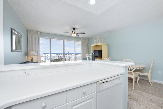 1515 SE Miracle Strip Pkwy Unit 613, Fort Walton Beach, FL 32548 - kitchen with dishwasher, baseboards, light wood-style flooring, a ceiling fan, and light countertops