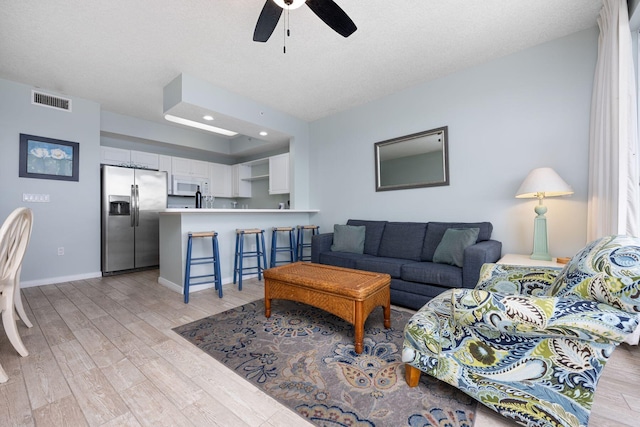 1515 SE Miracle Strip Pkwy Unit 613, Fort Walton Beach, FL 32548 - living room featuring light wood-style flooring, a ceiling fan, baseboards, and recessed lighting