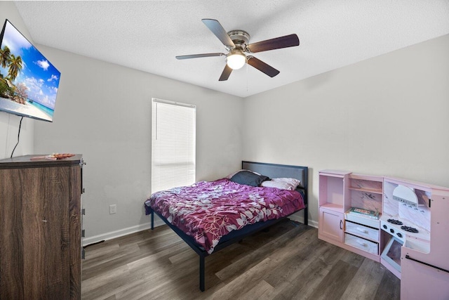 4887 Martina Way, Gulf Breeze, FL 32563 - bedroom with wood finished floors, ceiling fan, a textured ceiling, and baseboards