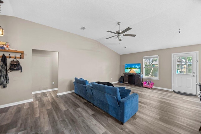 4887 Martina Way, Gulf Breeze, FL 32563 - living room featuring vaulted ceiling, wood finished floors, a ceiling fan, baseboards, and a textured ceiling