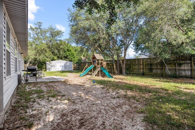 4887 Martina Way, Gulf Breeze, FL 32563 - fenced backyard with a playground and a patio area
