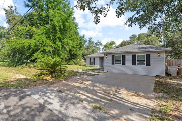 4887 Martina Way, Gulf Breeze, FL 32563 - single story home featuring concrete driveway, a shingled roof, and a patio