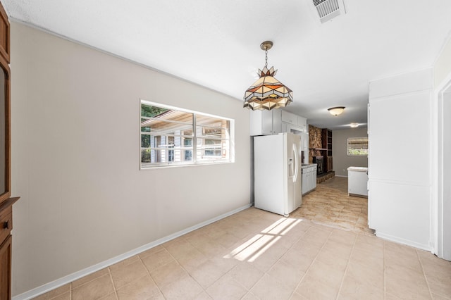814 Tuxedo Dr, Fort Walton Beach, FL 32547 - unfurnished dining area with baseboards and a fireplace