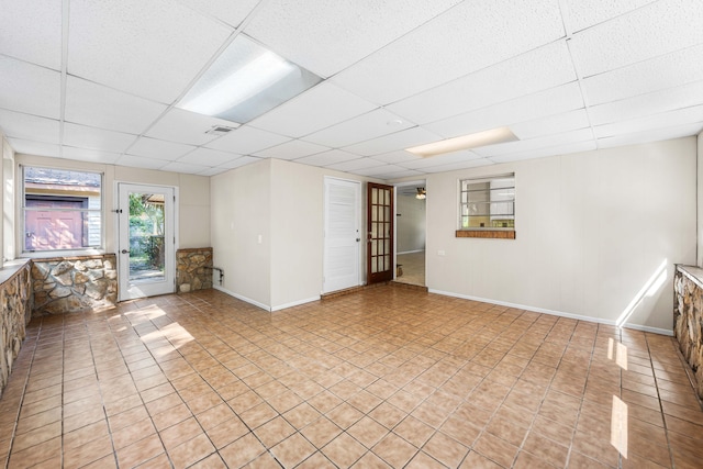 814 Tuxedo Dr, Fort Walton Beach, FL 32547 - unfurnished room with a paneled ceiling, light tile patterned floors, and baseboards