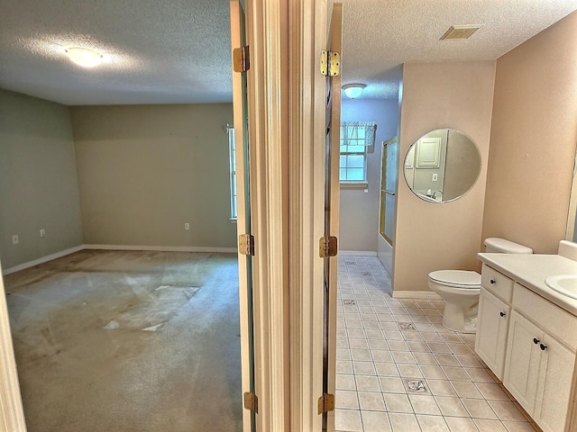 4868 Orlimar St, Crestview, FL 32536 - bathroom featuring a textured ceiling, vanity, enclosed tub / shower combo, and tile patterned floors