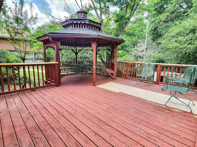 4868 Orlimar St, Crestview, FL 32536 - wooden deck featuring a gazebo and outdoor dining area