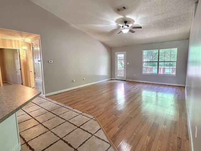 4868 Orlimar St, Crestview, FL 32536 - spare room with a ceiling fan, a textured ceiling, and wood finished floors