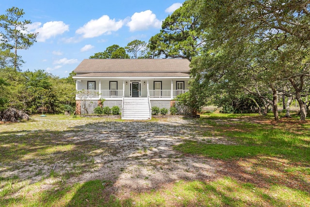 84 Old Miller Pl, Santa Rosa Beach, FL 32459 - view of front facade featuring covered porch and stairway