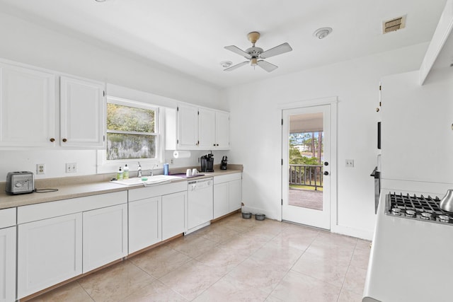 84 Old Miller Pl, Santa Rosa Beach, FL 32459 - kitchen featuring white dishwasher, white cabinets, plenty of natural light, and light countertops