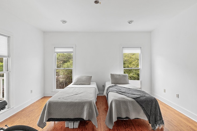 84 Old Miller Pl, Santa Rosa Beach, FL 32459 - bedroom with multiple windows and light wood-type flooring