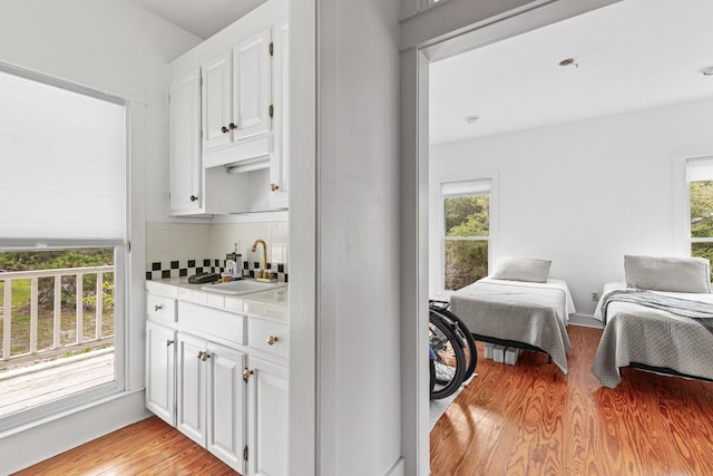 84 Old Miller Pl, Santa Rosa Beach, FL 32459 - bar with light wood-style flooring, healthy amount of natural light, and backsplash