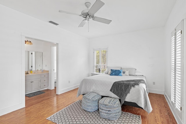 84 Old Miller Pl, Santa Rosa Beach, FL 32459 - bedroom with multiple windows, light wood-style flooring, ensuite bath, and ceiling fan