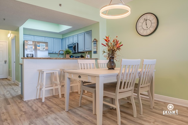 112 Seascape Dr Unit 704, Miramar Beach, FL 32550 - dining room with light wood-style floors and baseboards