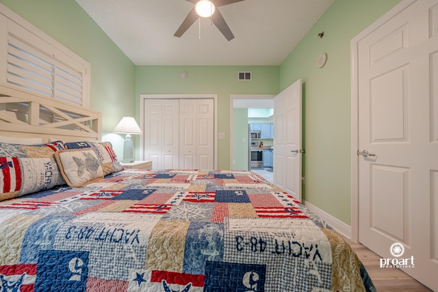 112 Seascape Dr Unit 704, Miramar Beach, FL 32550 - bedroom featuring wood finished floors, a closet, a ceiling fan, and baseboards