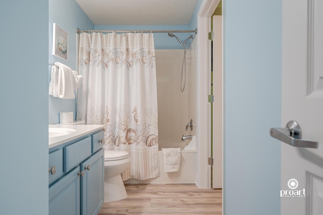 112 Seascape Dr Unit 704, Miramar Beach, FL 32550 - full bath with toilet, vanity, shower / bath combo, and wood finished floors