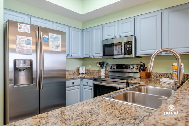 112 Seascape Dr Unit 704, Miramar Beach, FL 32550 - kitchen with stainless steel appliances, a sink, and light stone counters