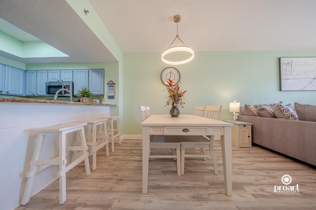 112 Seascape Dr Unit 704, Miramar Beach, FL 32550 - dining space featuring light wood-type flooring and baseboards