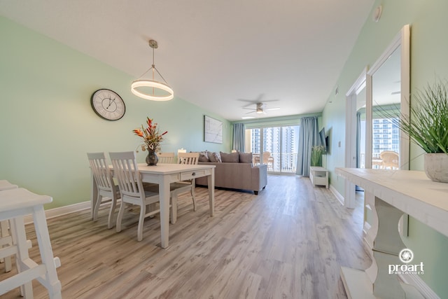 112 Seascape Dr Unit 704, Miramar Beach, FL 32550 - dining room with light wood-style flooring, baseboards, and ceiling fan