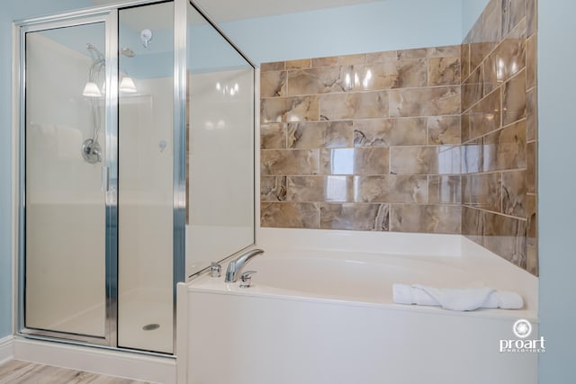 112 Seascape Dr Unit 704, Miramar Beach, FL 32550 - full bathroom with a shower stall and a garden tub