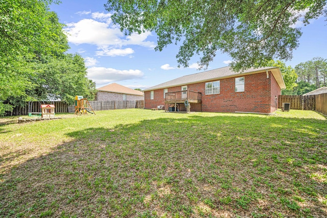 138 Conquest Ave, Crestview, FL 32536 - view of yard with a playground, central AC, and a wooden deck